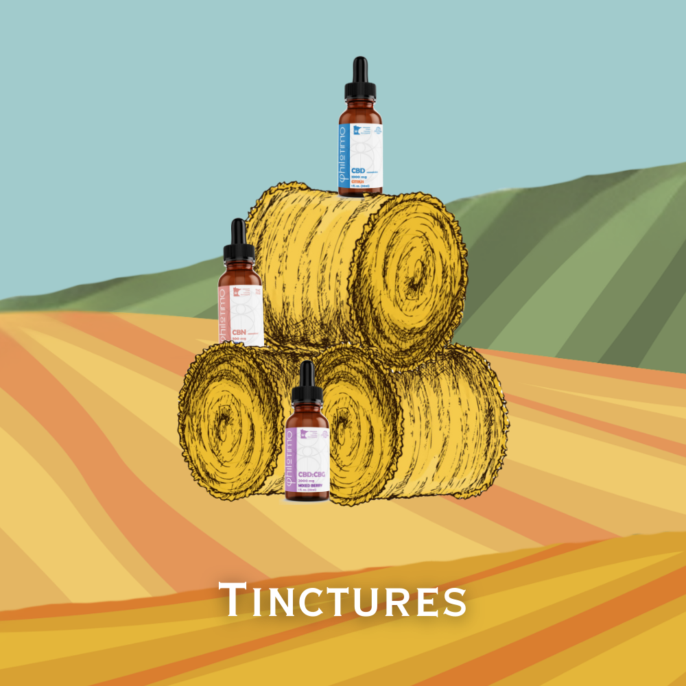 Bottles of Philotimo hemp tinctures on hay bales with a scenic background